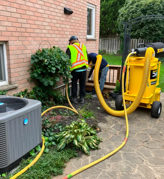 airspade air vac in window well.